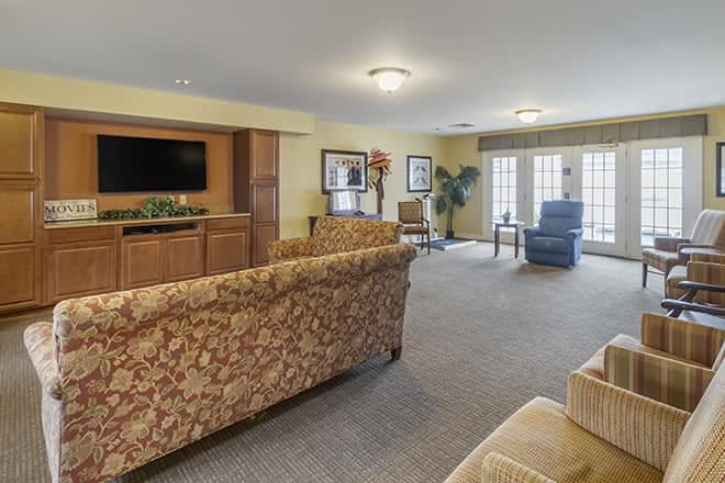 A cozy living room with comfortable seating and a television.