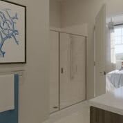 A modern bathroom interior with wall art and a neatly arranged sink area.