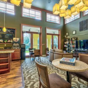 A cozy and modern cafe interior with comfortable seating and ambient lighting.