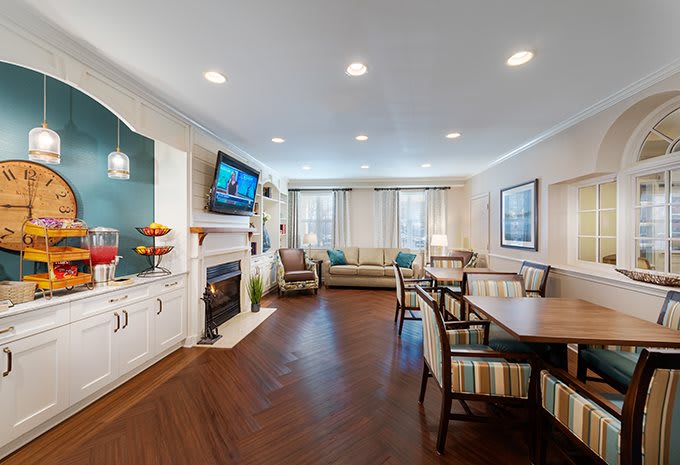 A modern living room with a fireplace, television, and seating area.