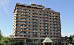 A multi-story residential apartment building with balconies.