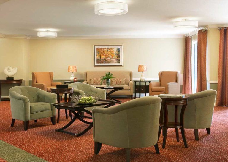 A cozy living room with comfortable seating and elegant decor.