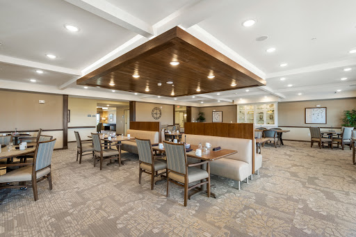 A modern dining area featuring stylish booth seating and elegant lighting.