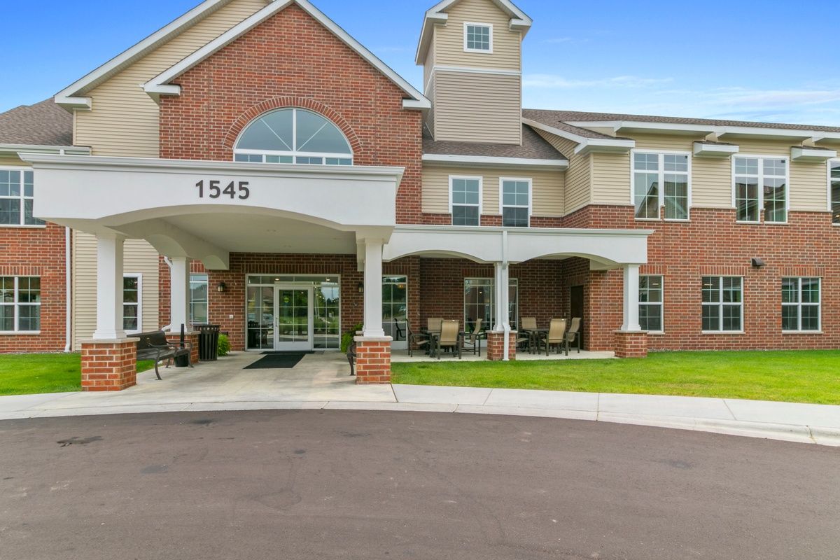 A modern brick residential building with an inviting entrance.