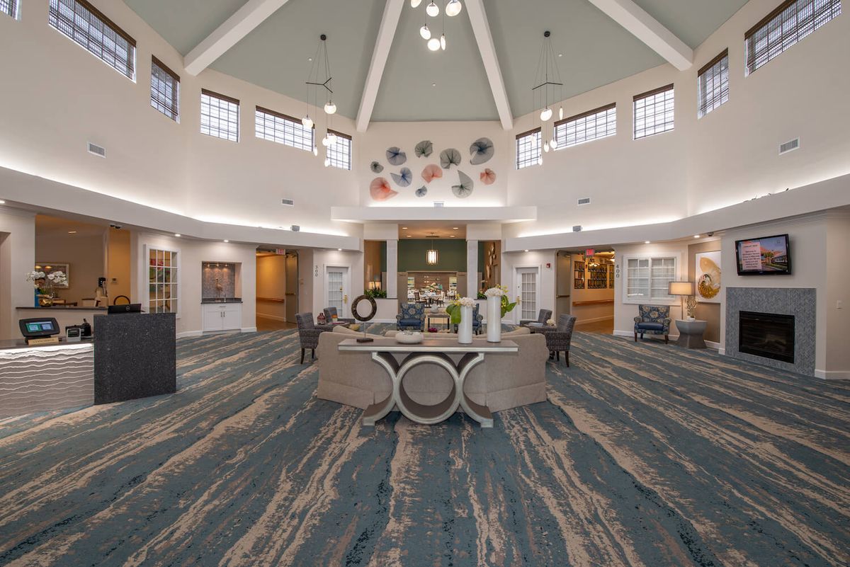 A spacious and elegantly designed lobby with modern dcor features and comfortable seating.
