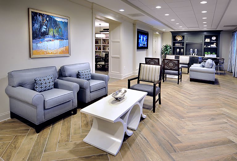 A modern and stylish lobby area with comfortable seating and decorative artwork.