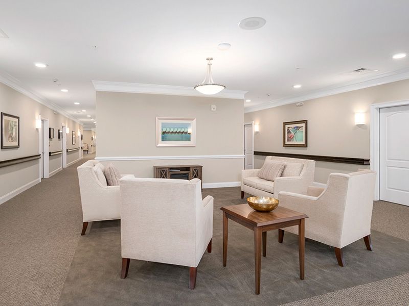 A modern and well-lit lobby with comfortable seating arrangements and tasteful decor.