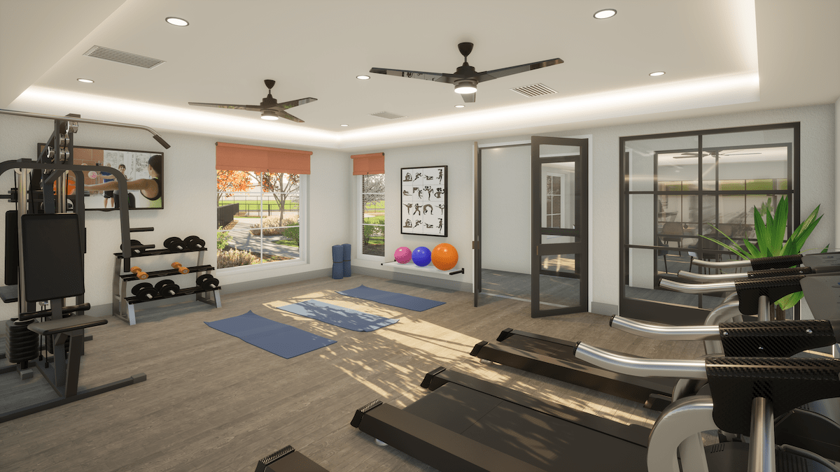 A modern fitness room equipped with yoga mats, dumbbells, exercise balls, and treadmills.