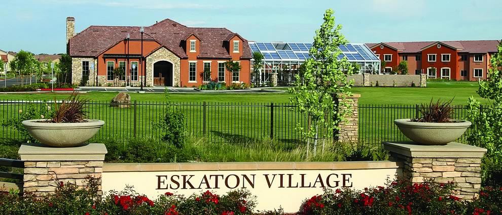 A view of Eskaton Village featuring a residential house and a well-maintained landscape.