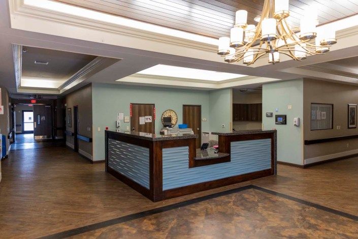 A modern reception area with stylish lighting and wooden accents.