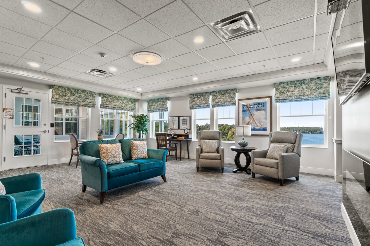 A modern lobby area with comfortable seating and large windows.