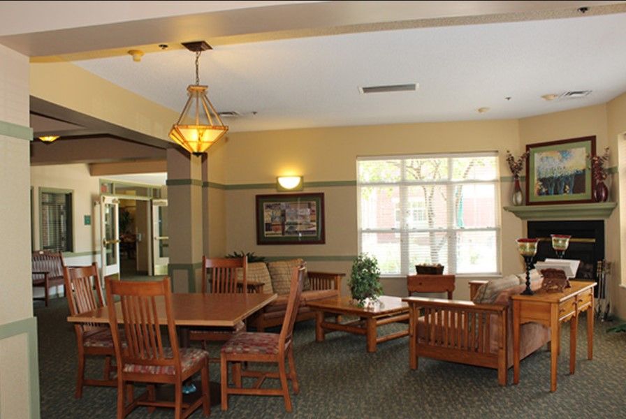 A cozy dining area with wooden furniture and warm lighting.