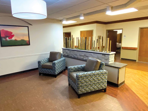 A cozy waiting area featuring comfortable chairs and a modern design.