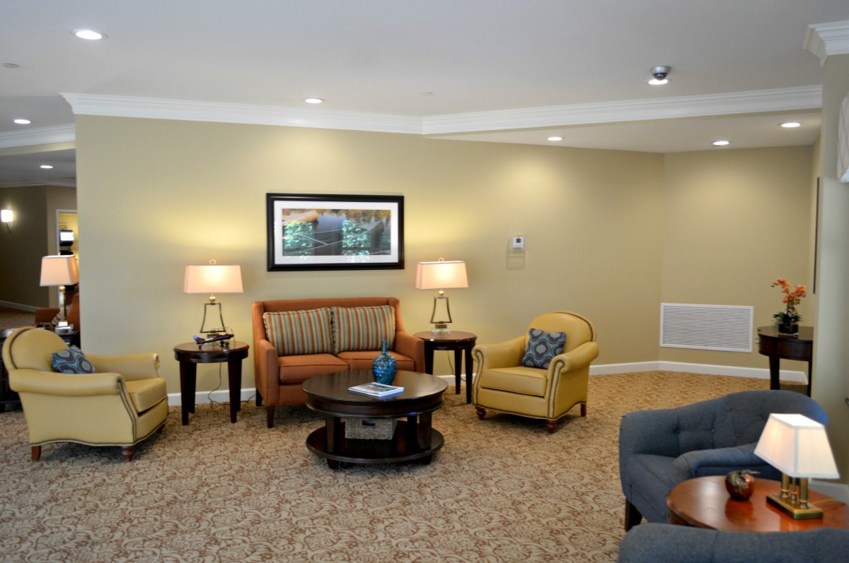 A cozy living room with comfortable seating and warm lighting.