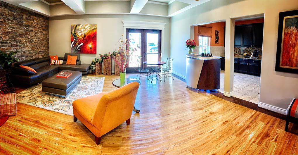 A modern living room with colorful accents and contemporary design elements.