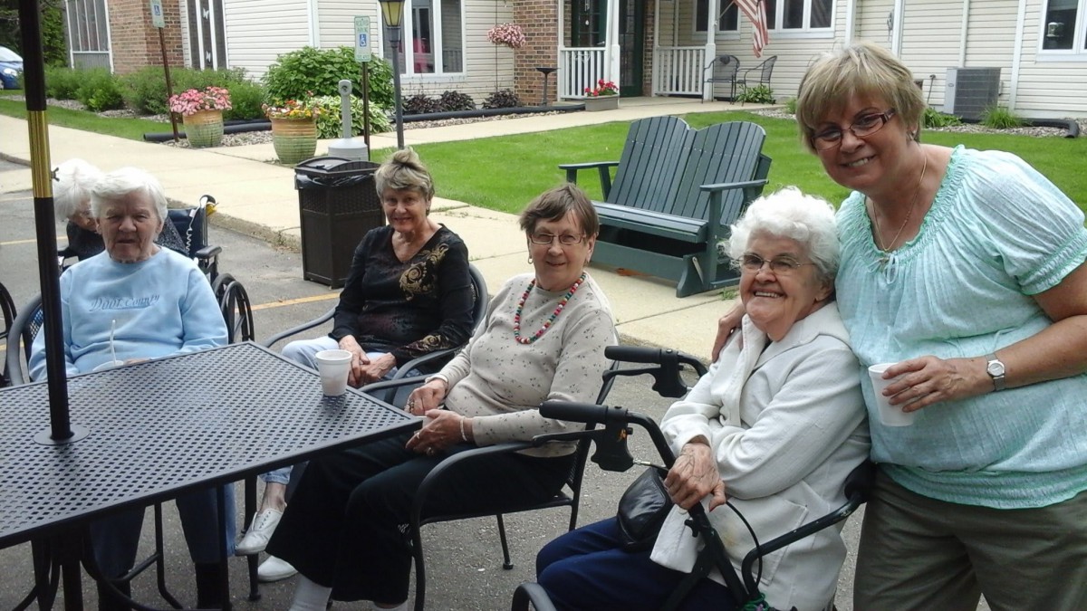 A group of seniors enjoying a social gathering outdoors.
