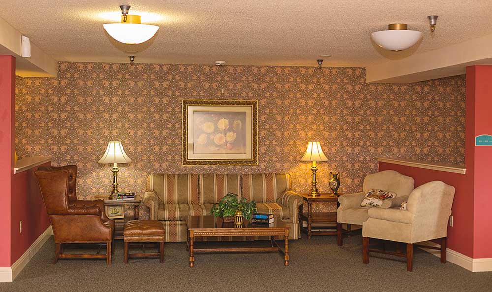 A cozy living room with classic furniture and warm lighting.
