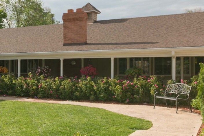 A charming house with a well-maintained garden and inviting porch.