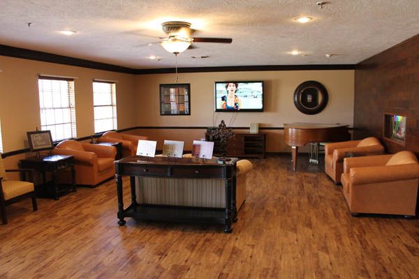 A spacious living room with comfortable seating and a modern entertainment setup.