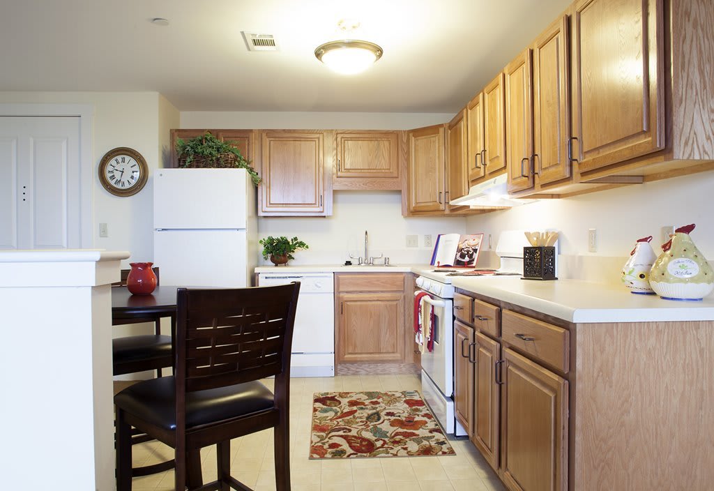 Cozy kitchen with wooden cabinets and modern appliances.