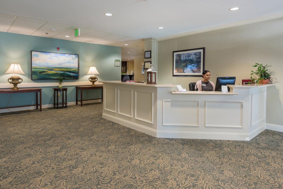 A welcoming reception area with a front desk and seating arrangements.