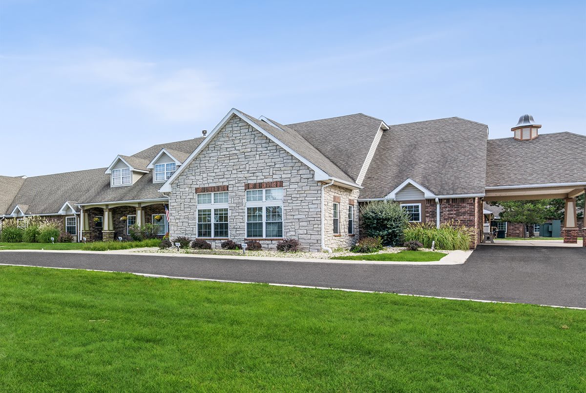 A suburban residential house with a well-maintained lawn.