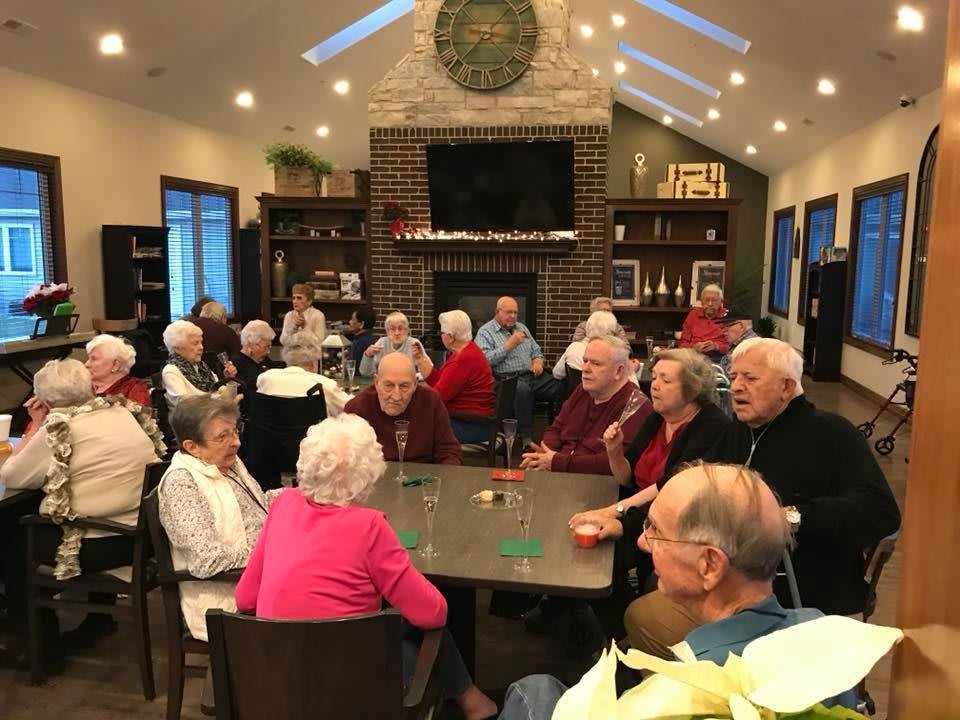 A group of seniors socializing in a community setting.