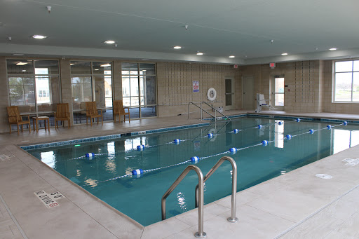 A spacious indoor swimming pool designed for relaxation and fitness.