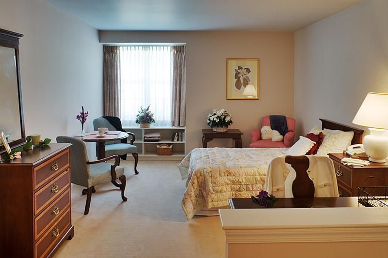 A cozy bedroom with elegant furniture and decor.