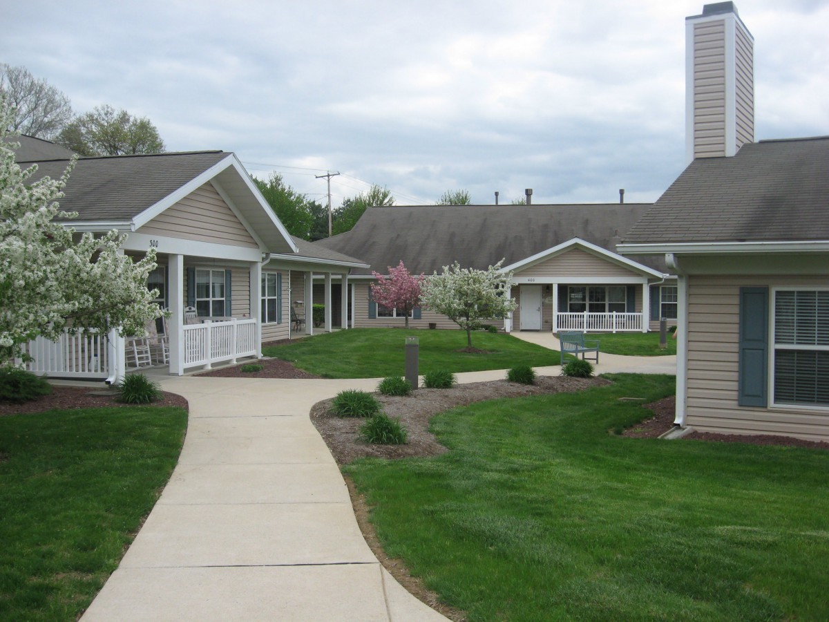 A peaceful residential area with pathways and well-maintained gardens.