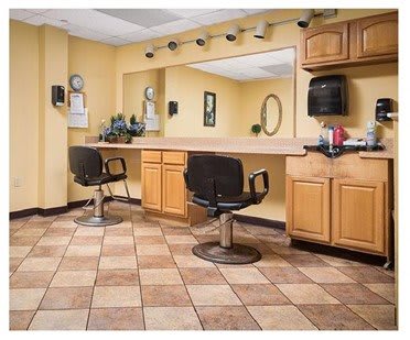 A well-organized hair salon interior with chairs and large mirrors.