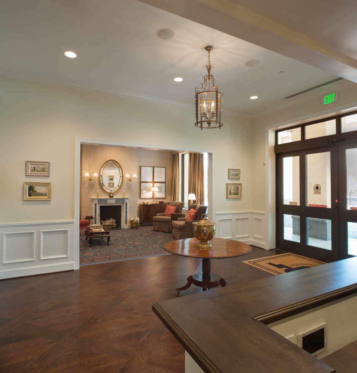 A well-decorated lobby with elegant furniture and lighting.