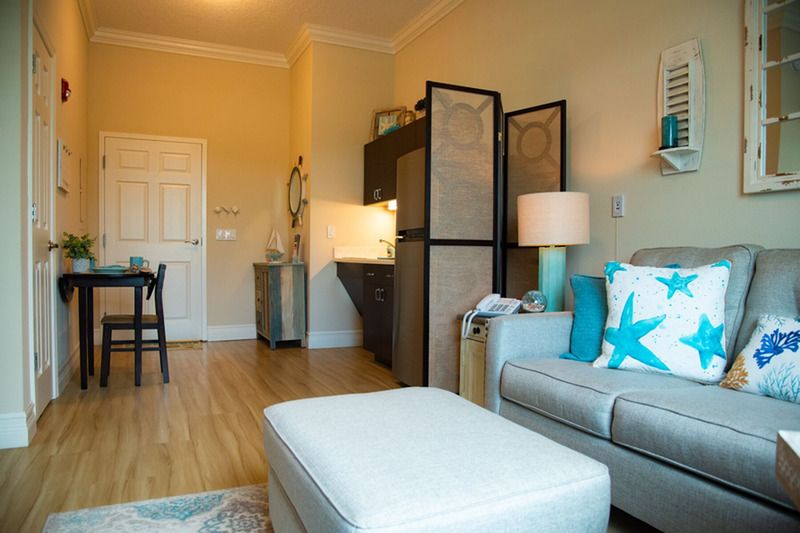 A cozy living room with a stylish sofa, lighting, and elegant decor.