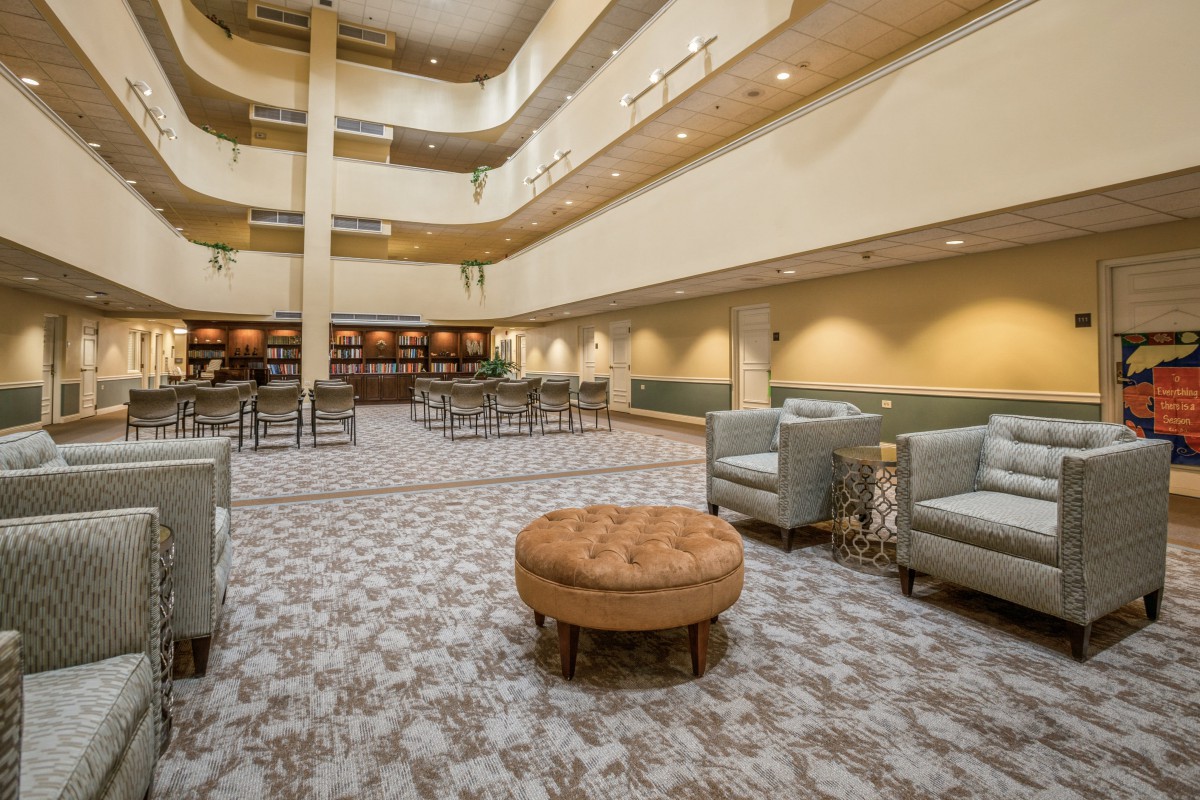Spacious hotel lobby with modern seating and elegant decor.
