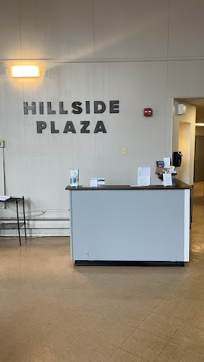 The reception area of Hillside Plaza featuring a modern design.
