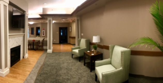 A cozy lobby area with comfortable seating and soft lighting.