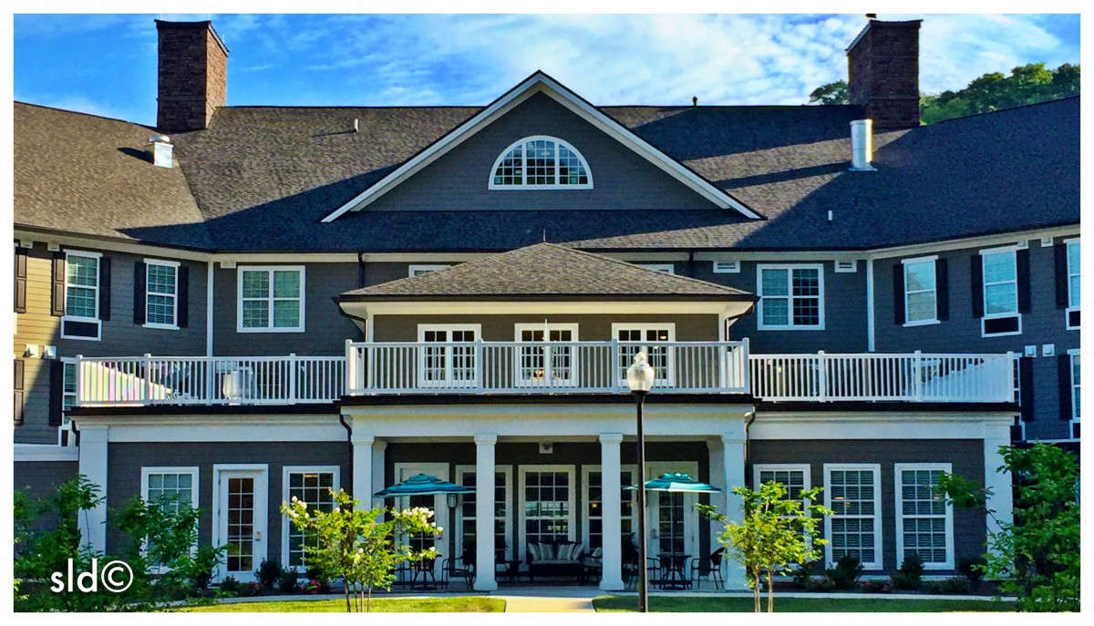 A large, elegant residential building with multiple windows and balconies.