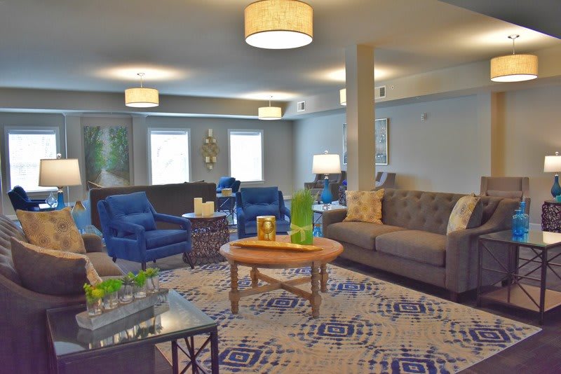 Spacious living room with modern furniture and decor.
