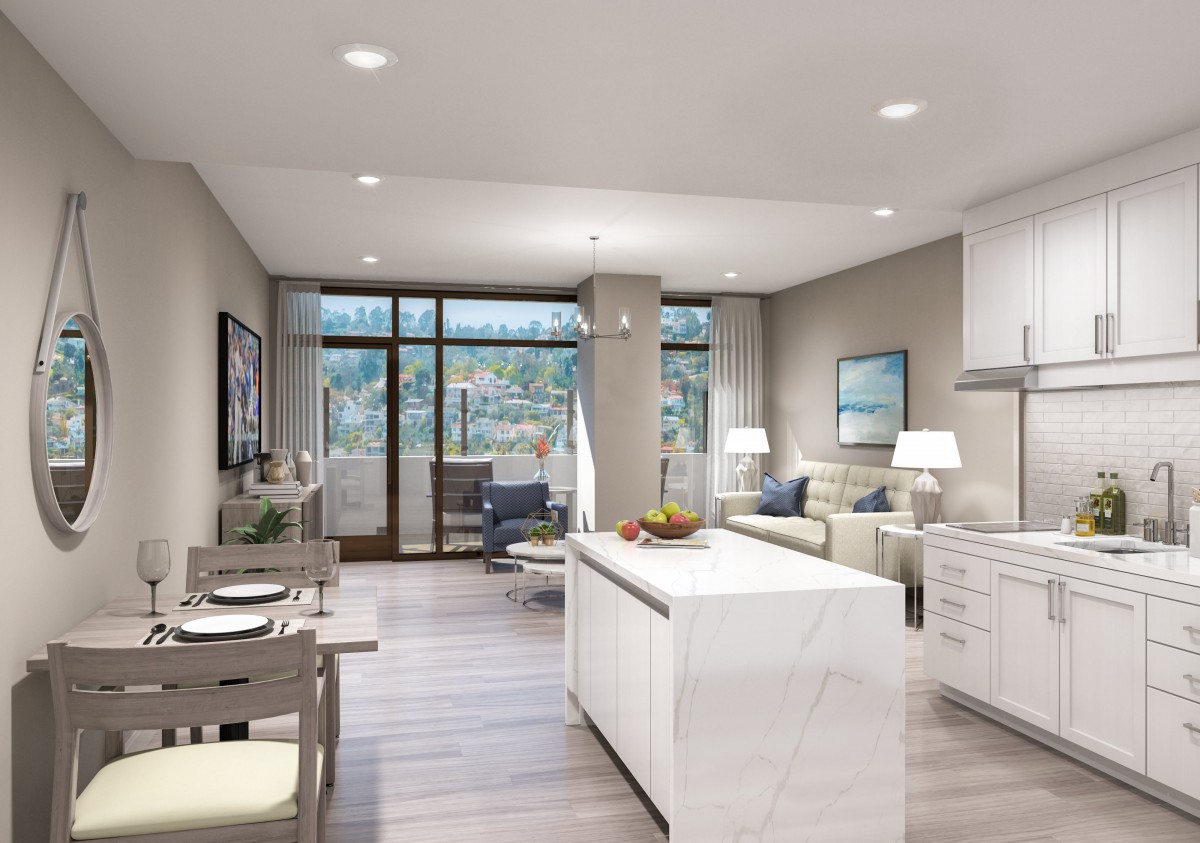 A modern open-concept living space featuring a kitchen island and comfortable seating area.