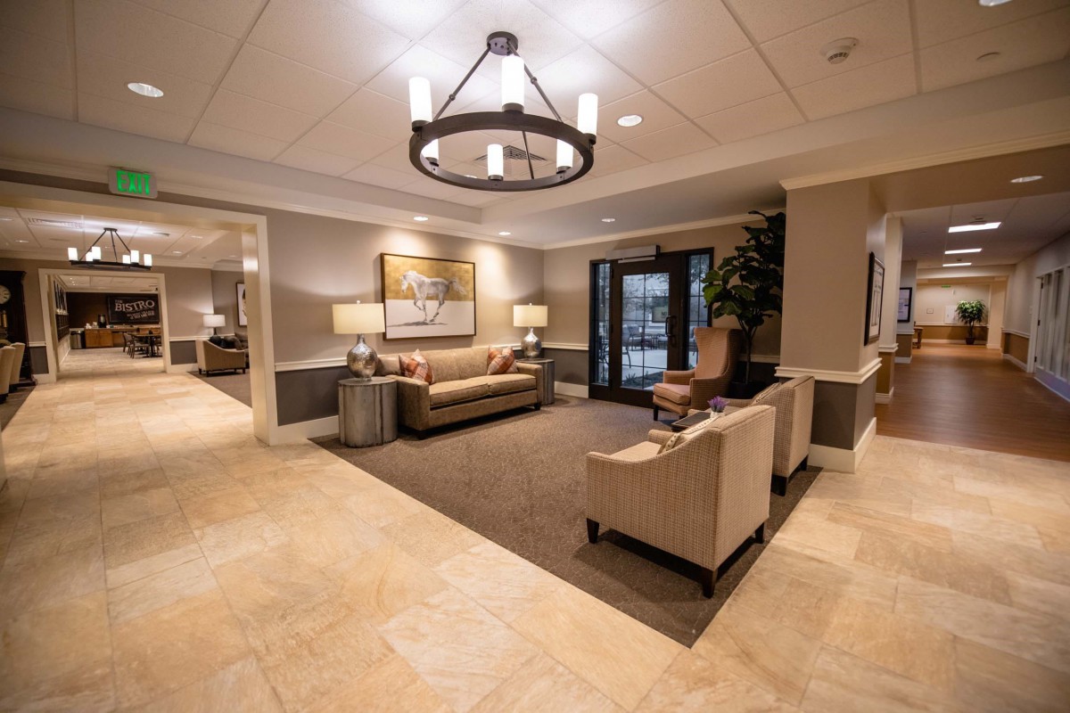 A well-furnished and elegantly decorated lobby area with comfortable seating and warm lighting.