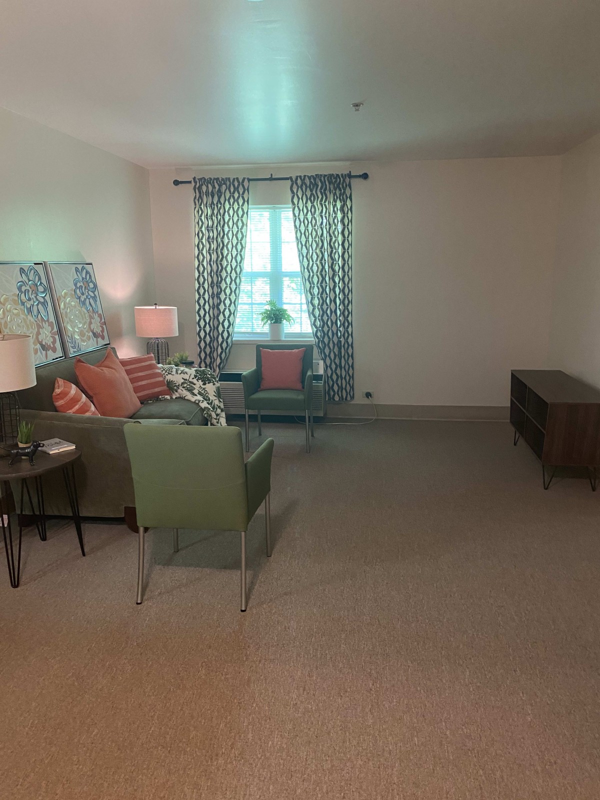A cozy living room with stylish furniture and decor.