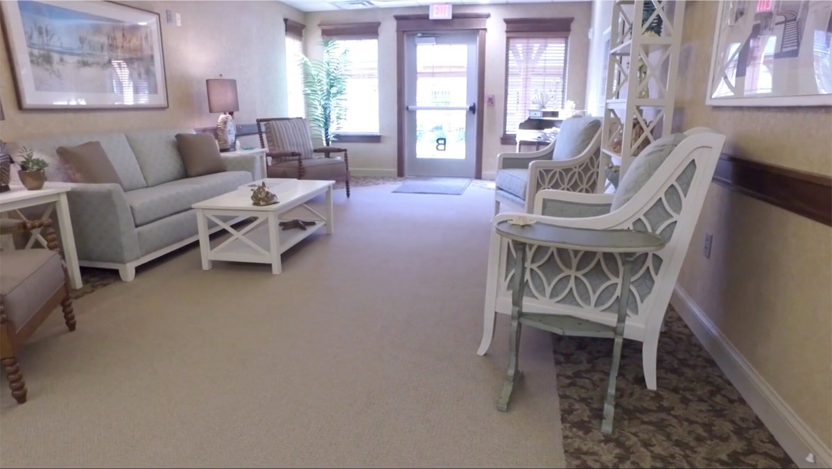 A bright and cozy living room with comfortable seating and decorative elements.