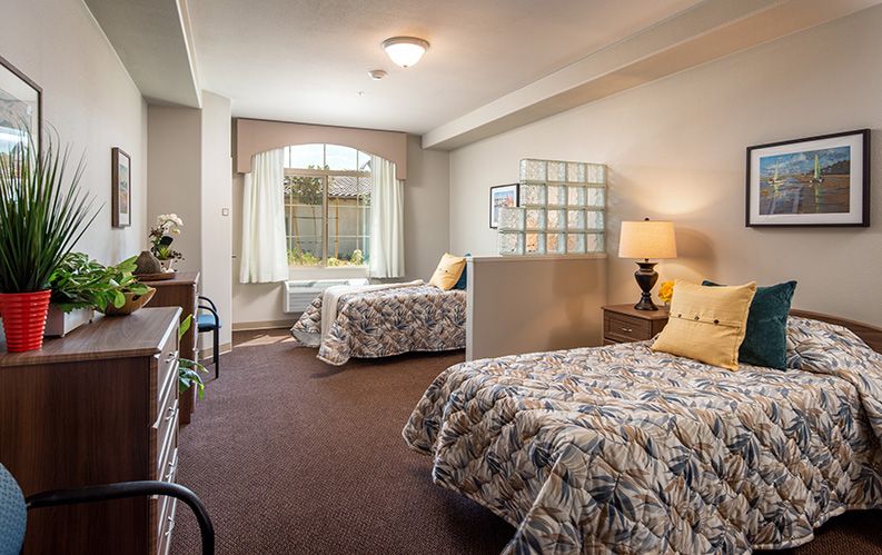 A cozy bedroom with twin beds, decorated in a warm and inviting style.