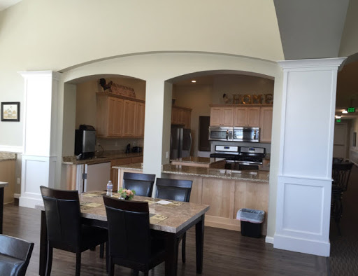 A modern kitchen and dining area featuring an open layout with wooden furnishings.