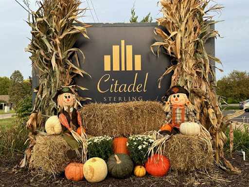 A festive autumn display featuring scarecrows and pumpkins at the Citadel.