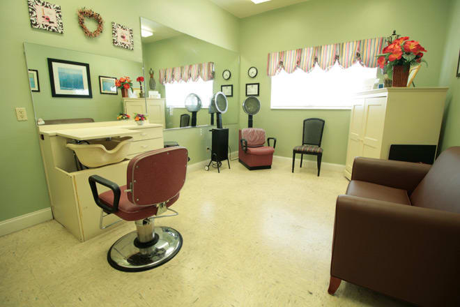 A vintage-style salon with chairs, mirrors, and hairdressing equipment.