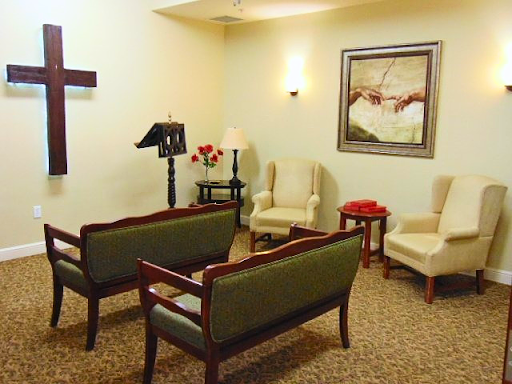 A serene waiting room with comfortable seating, warm lighting, and decorative artwork.