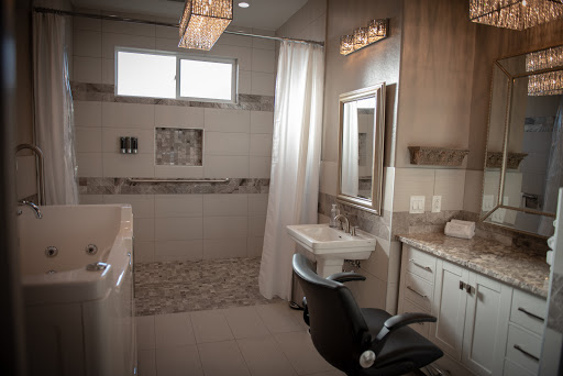 A modern bathroom featuring a spacious shower area, stylish vanity, and elegant lighting.