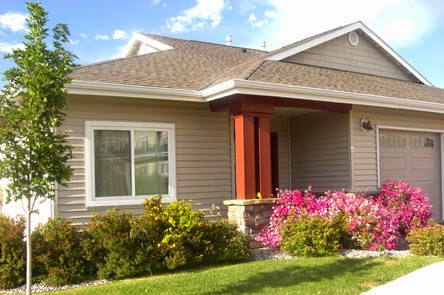 A charming house with a colorful flower garden.