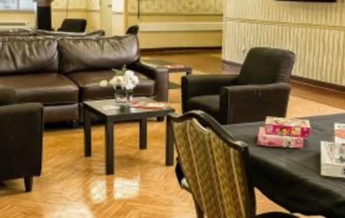 A cozy living room with comfortable seating and elegant decor.